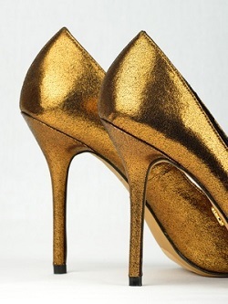 Pair of golden colored High Heels